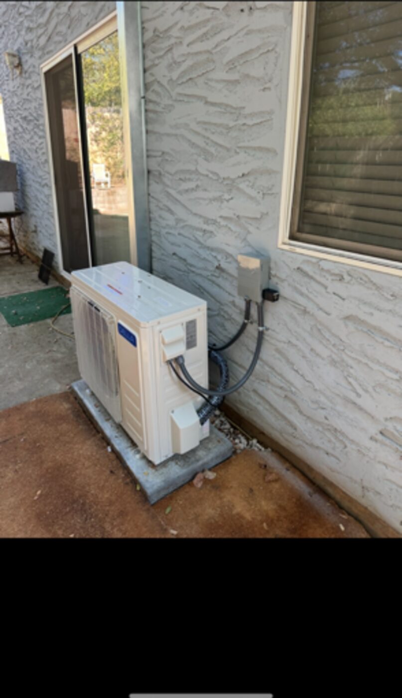 Ductless mini-split condenser and disconnect installed at a Redding CA home