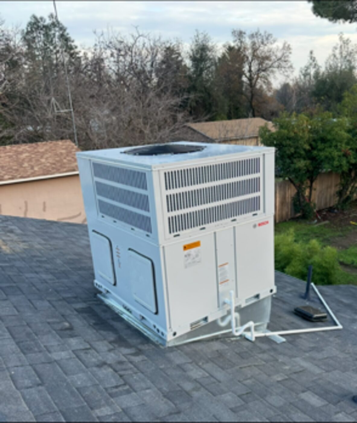 New rooftop package HVAC unit installed on a home in Anderson, California