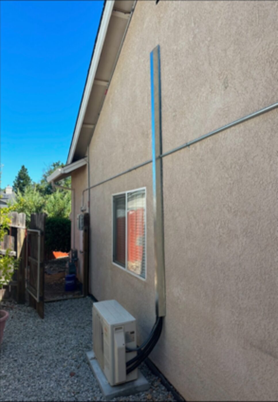 Mini-split line set run with line hide on a stucco home near Redding CA